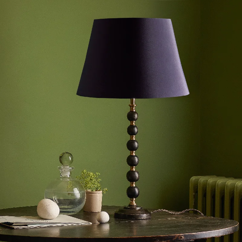 glass table lamps with a frosted surface for soft light diffusionSmaller Rosie table lamp in wood and brass glass table lamps with a frosted surface for soft light diffusionSmaller Rosie table lamp in wood and brass